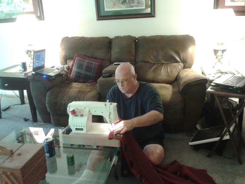 Chris and his sewing machine altering new drapes for the house. 2015